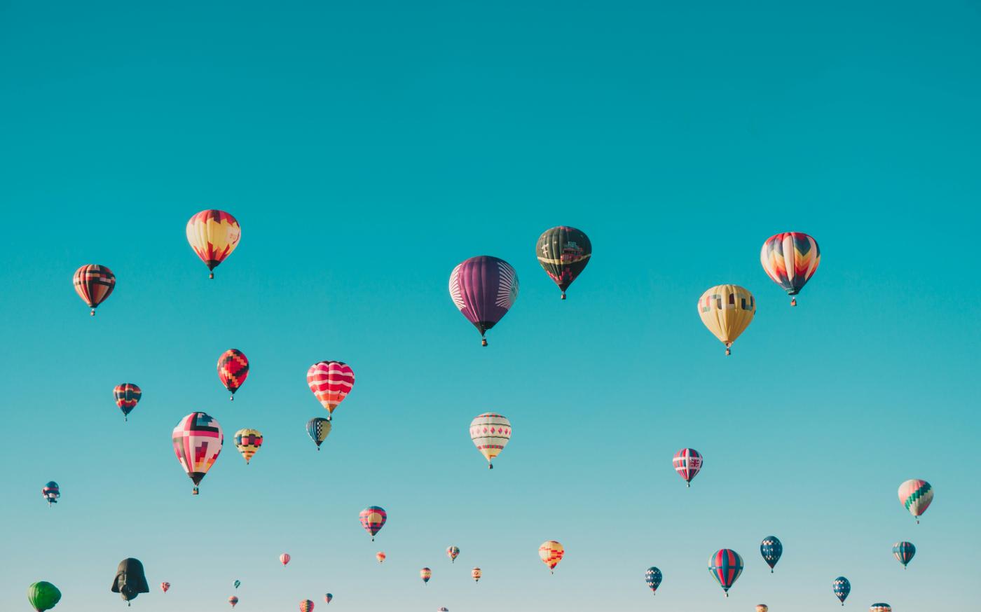 assorted-color hot air balloons during daytime by ian dooley courtesy of Unsplash.