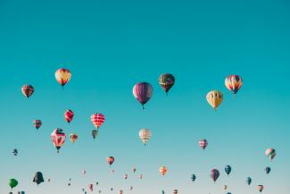 assorted-color hot air balloons during daytime by ian dooley courtesy of Unsplash.